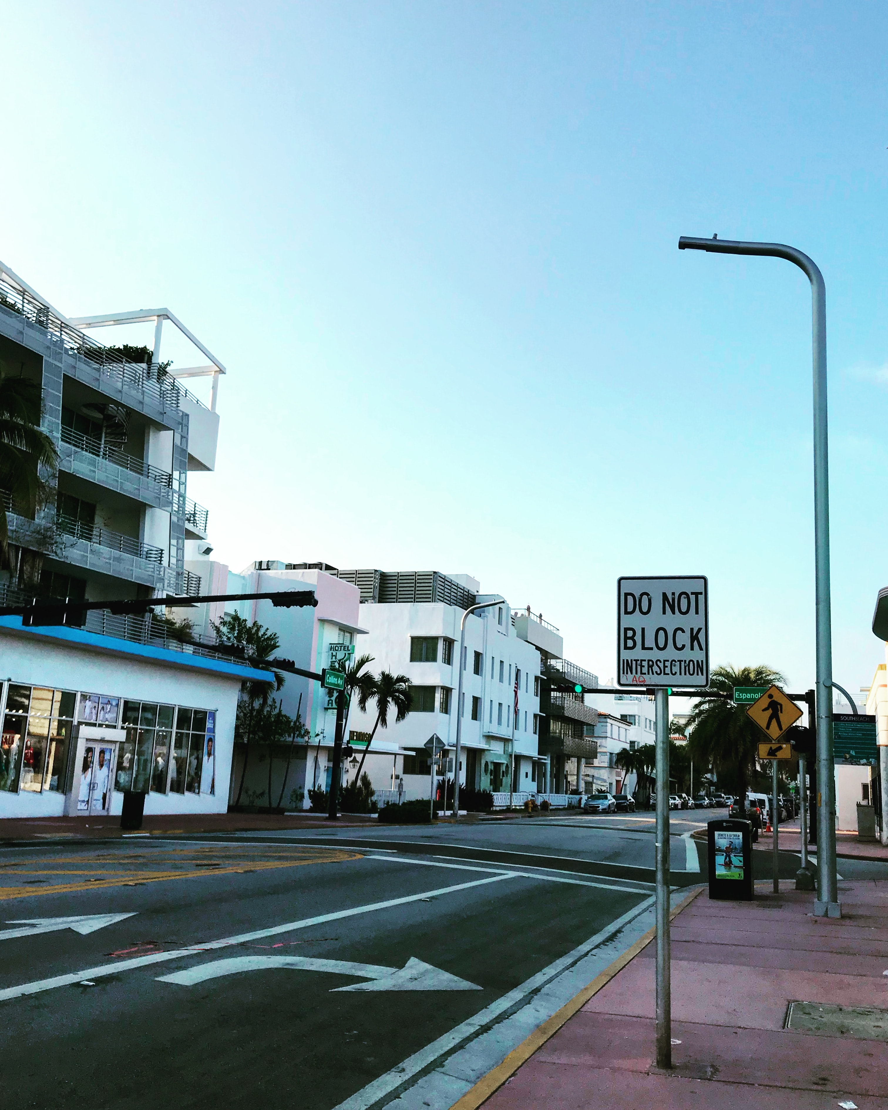 A street sign sitting on the side of a road in Miami Beach